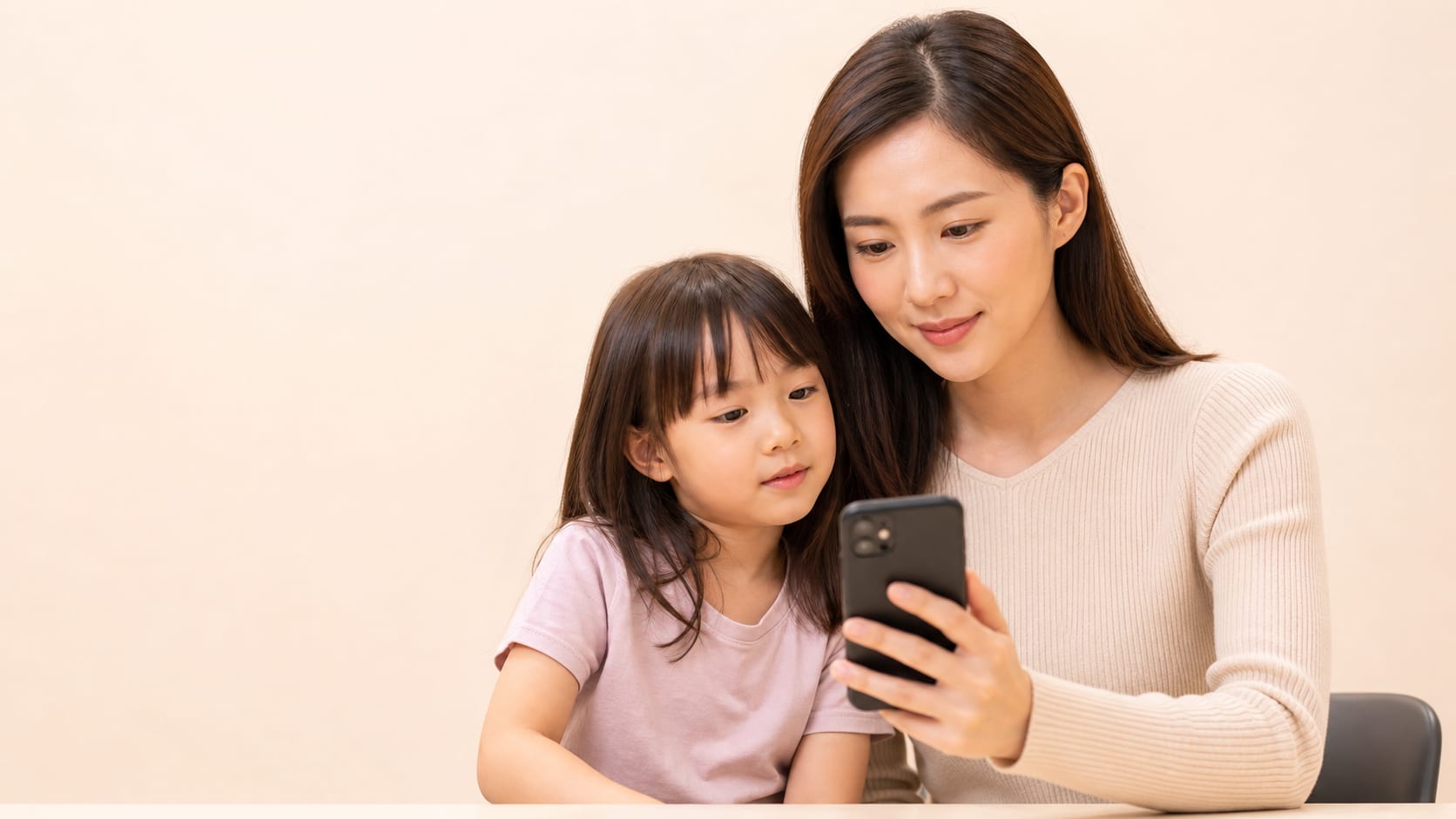 Parent and child preparing for a teleconsult in Singapore