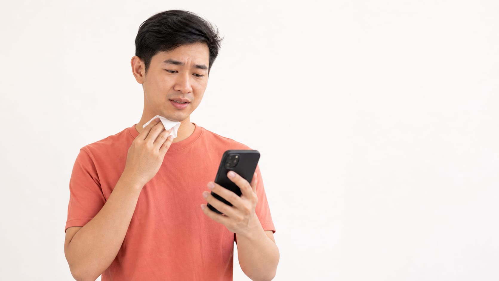 Patient with mild sore throat preparing for a teleconsult in Singapore