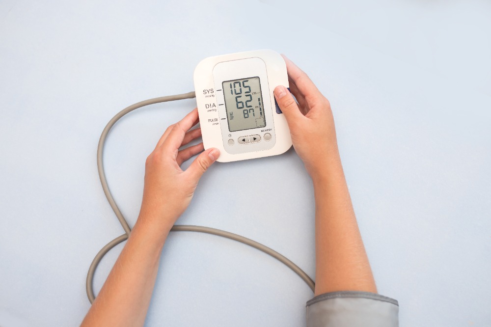 Illustration of high blood pressure management with medication reminders