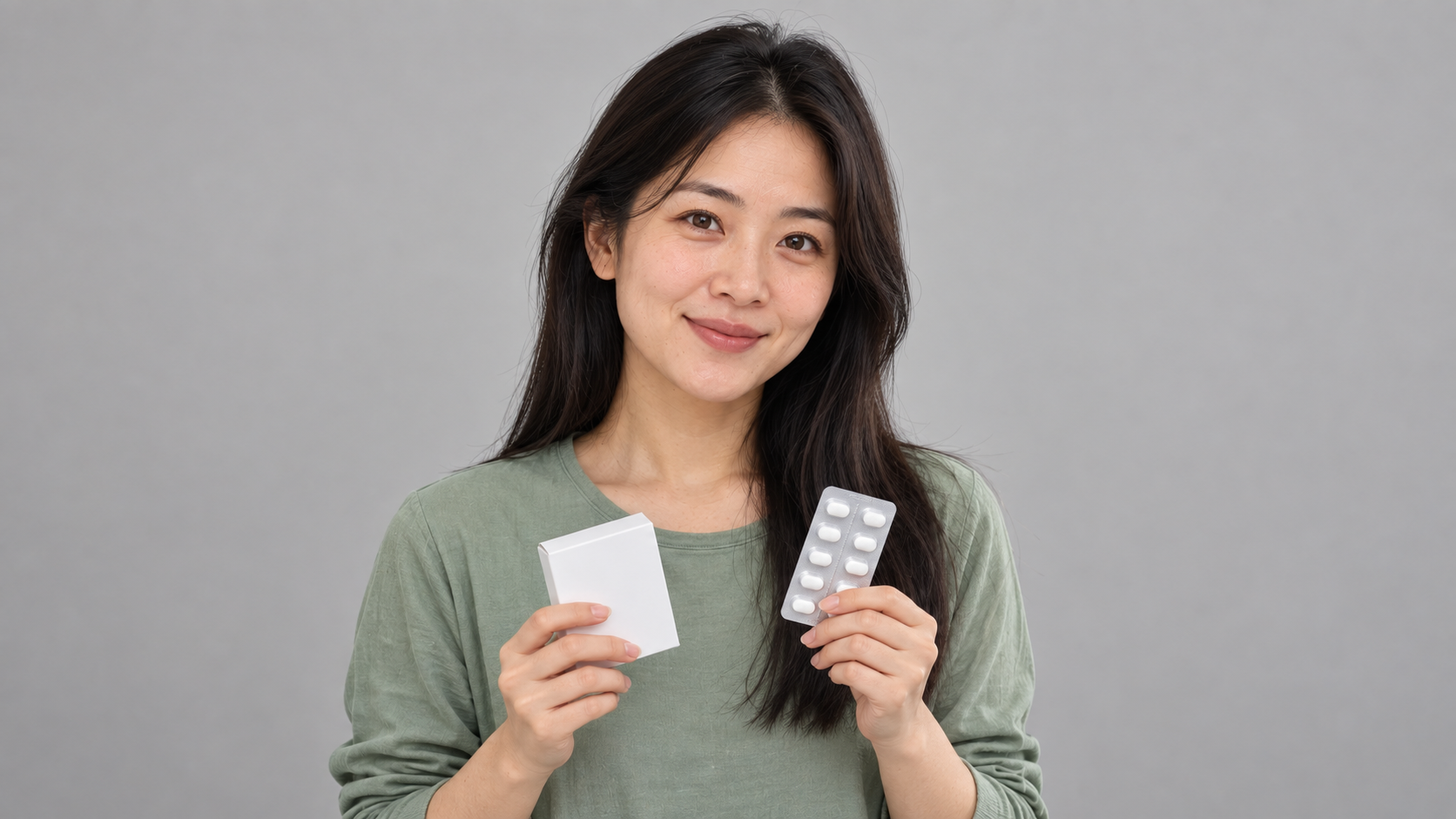 Photorealistic portrait of a young woman holding a medicine box and blister pack against a plain grey background