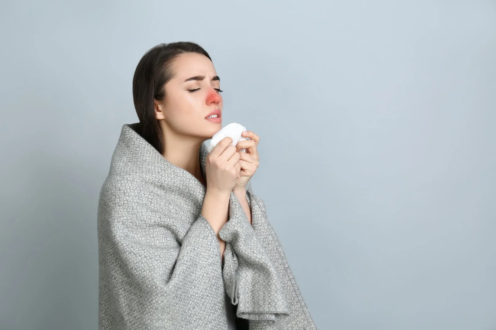 Patient resting at home with thermometer and medicine